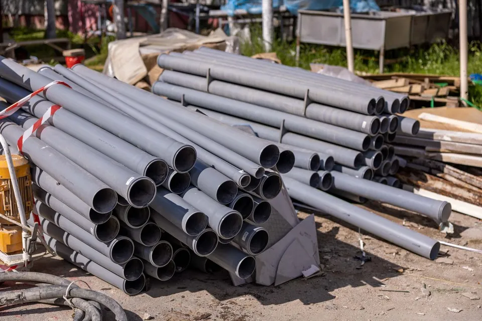 Stack of PVC pipes at a construction site - Pexels