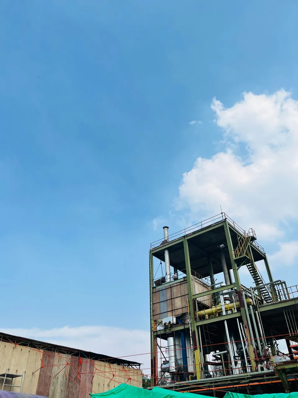 PET Material Center building exterior under clear blue sky in Verbania, Italy - Pexels