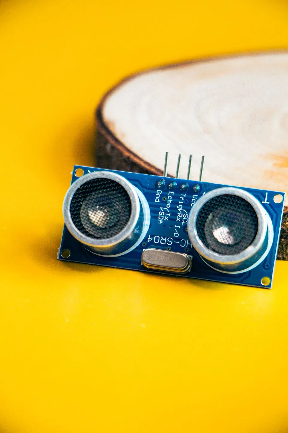 Ultrasonic sensor module on a yellow background - Pexels