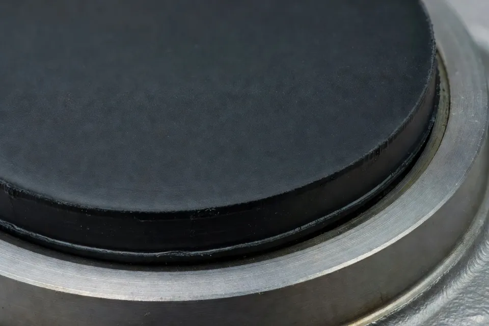Laboratory sample of a single coated elastomer sealing pad - plascentral.com