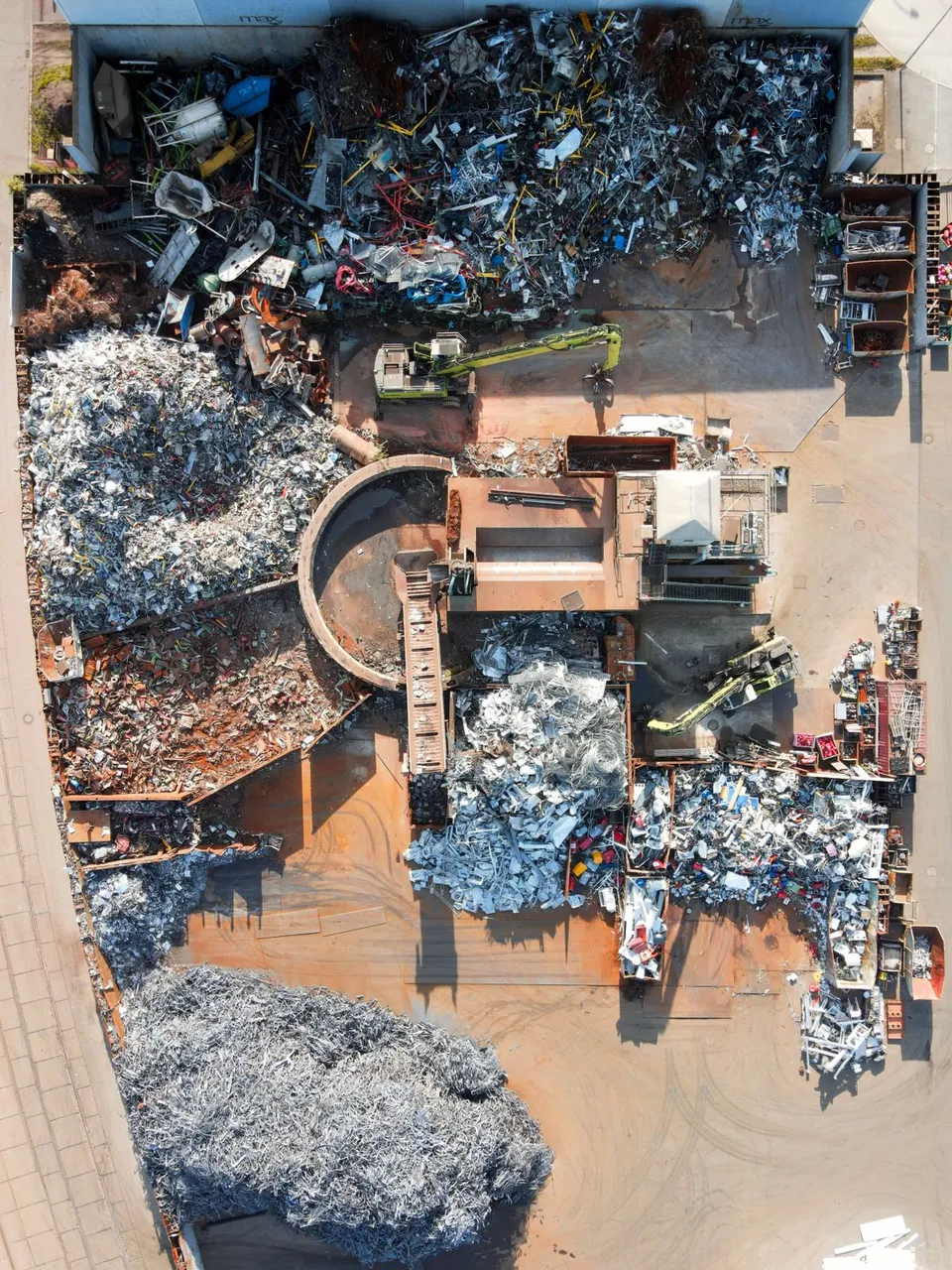 Bird's-eye view of a large garbage dump with scattered mixed waste - Pexels